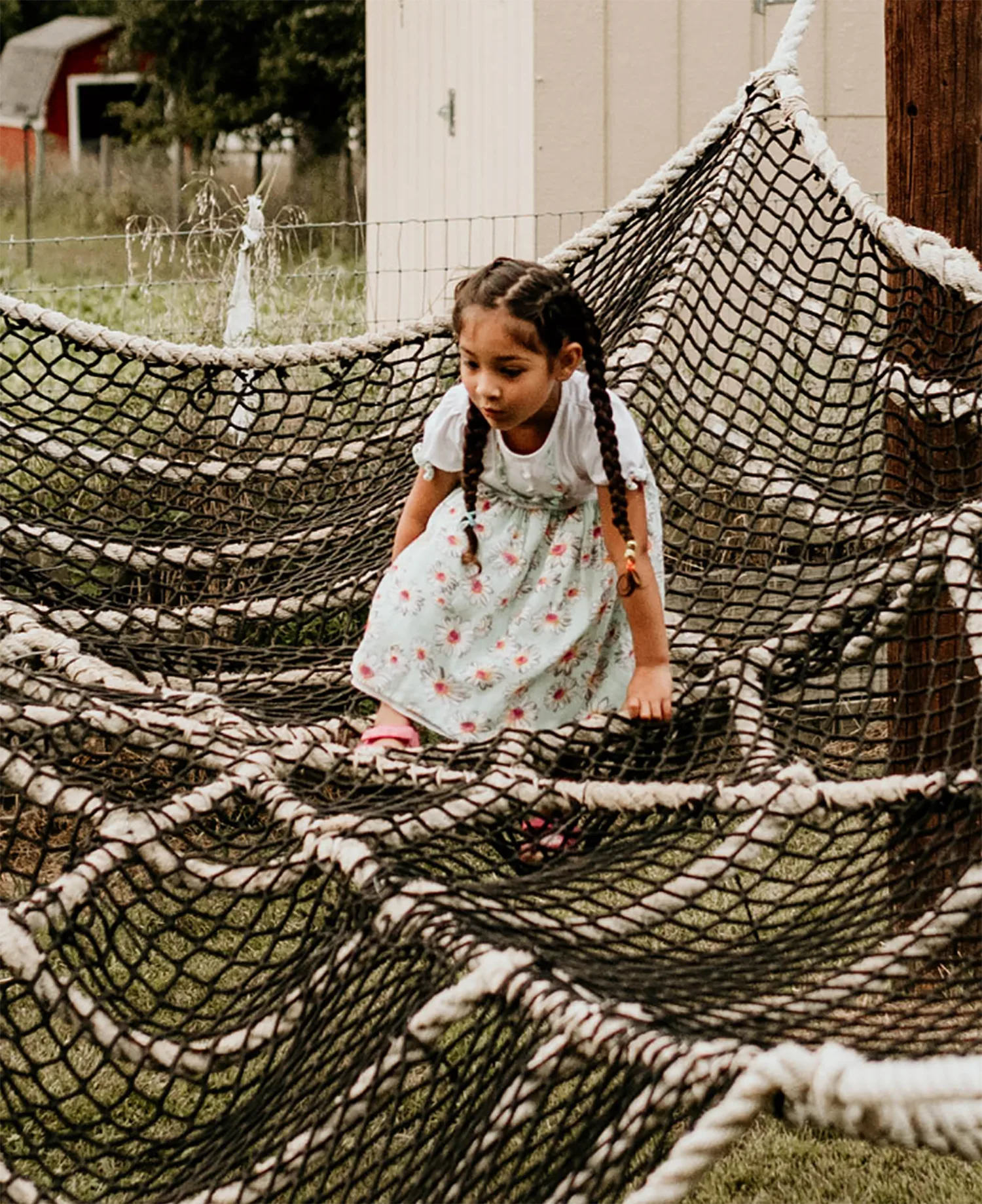 Kids climbing the giant spider web